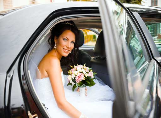 bride exiting wedding limo