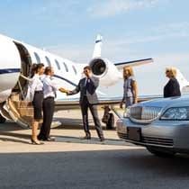 limo delivering clients to corporate jet